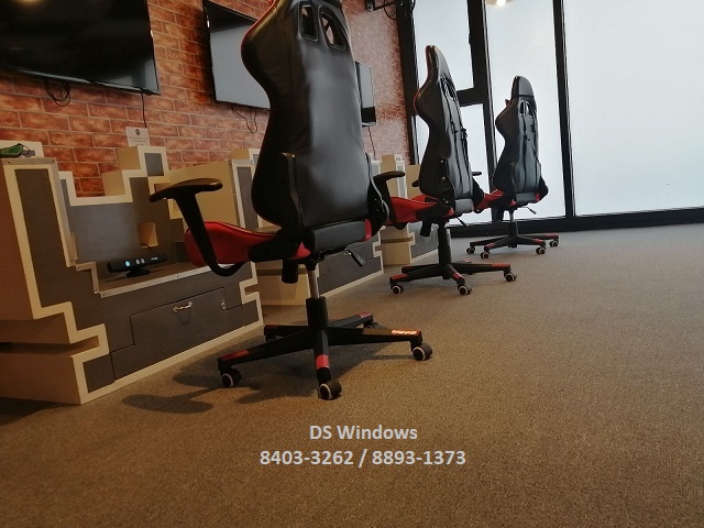 Wall-to-wall loop pile carpet in an entertainment room